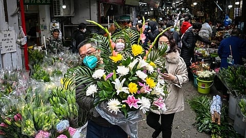 Wuhan, the Chinese city synonymous with with Covid-19, springs back to life for Lunar New Year's Eve, but many are mourning family members lost during the pandemic. (Photo | AFP)