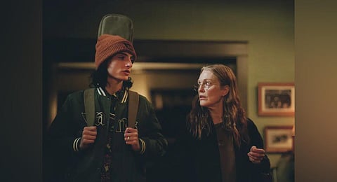 Finn Wolfhard, left, and Julianne Moore in a scene from ' When You Finish Saving The World.' (Photo | AP)