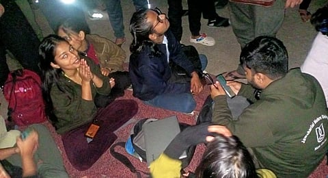 Students watching the documentary on their mobile phones. (Photo |EPS)