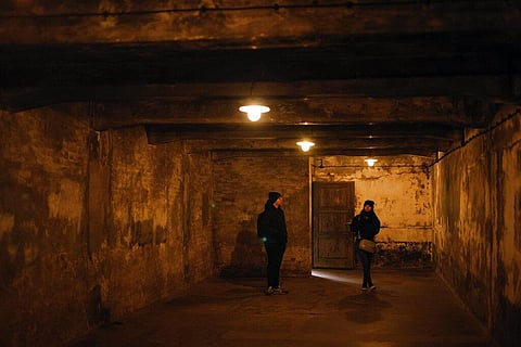 People visit the former gas chamber at the former Nazi German concentration and extermination camp Auschwitz-Birkenau in Oswiecim, Poland. (Photo | AP)