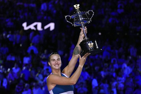 Aryna Sabalenka of Belarus holds the Daphne Akhurst Memorial Trophy after defeating Elena Rybakina of Kazakhstan in the women's singles final at the Australian Open tennis championship. (Photo | AP)