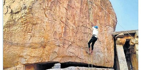  An enthusiast takes part in rock climbing at the Hampi Utsav on Friday | Express 