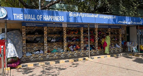 Clothes kept in bundles beside the Wall of Happiness near K Abishekapuram zonal office in Tiruchy on Saturday | M K Ashok Kumar