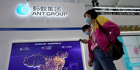Visitors past by the booth for Ant Group at the China International Fair for Trade in Services (CIFTIS) in Beijing. (File photo | AP)