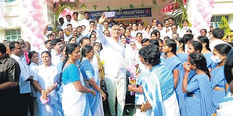 Health Minister T Harish Rao takes a selfie with staff of the Community Health Centre at Marriguda after inaugurating the 30-bed healthcare facility on Tuesday