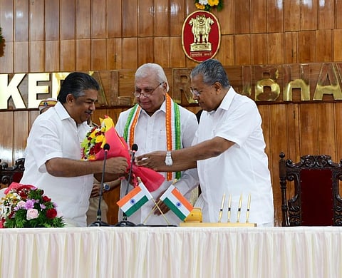 hief Minister Pinarayi Vijayan congratulates Saji Cherian who took oath as a minister as Governor Arif Mohammad Khan looks on. (Photo | Special Arrangement)
