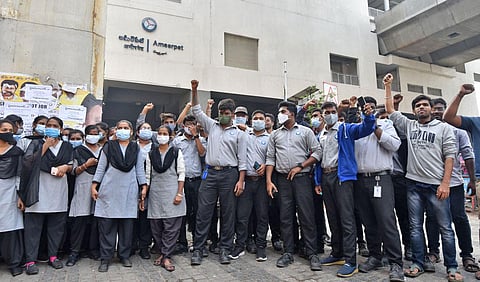 Contract employees of Hyderabad Metro Train Limited stage a protest at the Ameerpet Metro Station in Hyderabad. (Photo | Jwala)