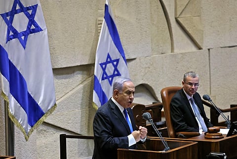 Israel's Prime Minister Benjamin Netanyahu (L) and Justice Minister Yariv Levin at the Knesset in Jerusalem, on June 13, 2021. (File Photo | AFP)