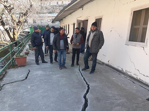 Uttarakhand officials survey an affected area in Joshimath. (Photo | Express)