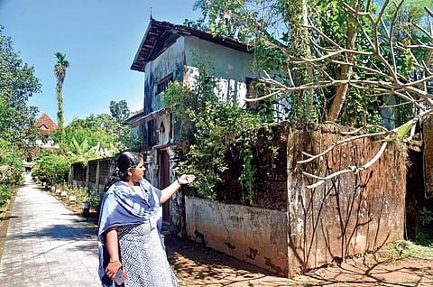 An officer shows the ruins inside Paliam Kovilakam complex