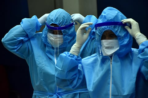 Healthcare workers getting ready by donning PPE with face shields. (File Photo | Rakesh Kumar, EPS)