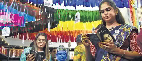 Visitors pore over books at The Queer Publishing House’ stall in the Chennai Book Fair at the YMCA grounds on Sunday | Ashwin Prasath