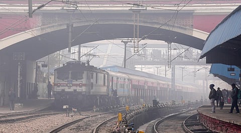 A train arrives at New Delhi railway station amid low visibility due to a thick layer of fog on a cold winter morning, in New Delhi, Monday, Jan. 9, 2023. (Photo | PTI)
