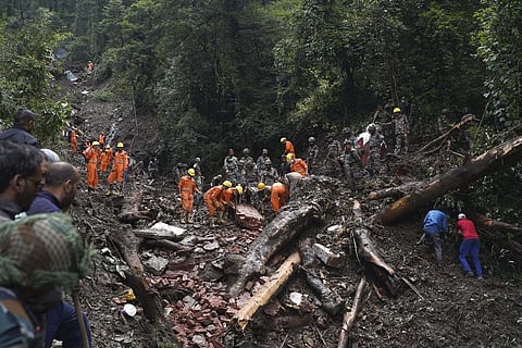 FILE - Rescuers search the debris for survivors after a landslide following heavy rainfall in Shimla, India, Aug. 17, 2023. (Photo | AP)