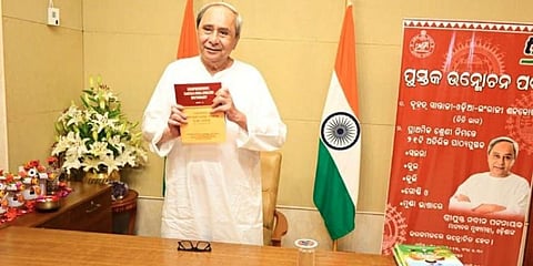 Chief Minister Naveen Patnaik releasing a Santali-Odia-English Sabdakosha at Naveen Niwas here on Saturday (Photo | Twitter)