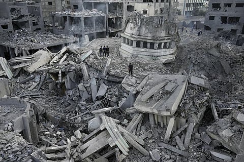 Palestinians inspect the rubble of the Yassin Mosque destroyed after it was hit by an Israeli airstrike at Shati refugee camp in Gaza City, early Monday, Oct. 9, 2023. (Photo | AP)
