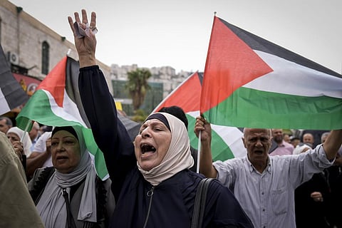 Palestinians attend a rally in support of Hamas and the Gaza Strip in the West Bank city of Nablus on Monday. (Photo | AP)