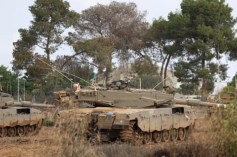 Israeli army Merkava tanks are positioned near the border with Gaza in southern Israel on October 10, 2023. (Photo | AFP)