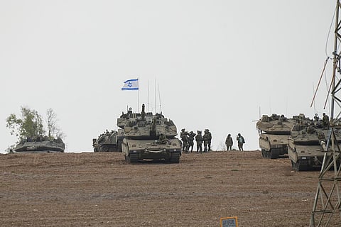Israeli soldiers are seen in a staging ground near the Israeli Gaza border, southern Israel, Monday, Oct. 9, 2023. (Photo | AP)