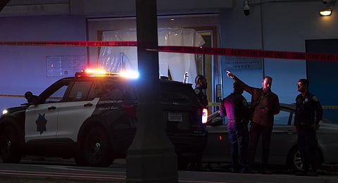 Police officers are seen outside the visa office of the Chinese consulate, where earlier a vehicle crashed into the building, in San Francisco, California. (Photo | AP)