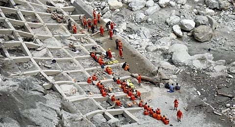 DRF personnel carry out the restoration work at flood-hit areas of Chungthang, in Mangan district, Sikkim | PTI