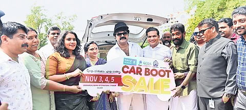Actor Anoop Menon releasing the logo of the car boot sale by handing it over to actor Gouri Nanda. GCDA chairman K Chandran Pillai, MP Hibi Eden, KMRL managing director Loknath Behera are also seen.