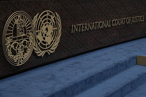 The logo of the International Court of Justice and that of the UN are seen on the judges' bench as preliminary hearings opened in Armenia's case against Azerbaijan, Oct. 12, 2023. (Photo | AP)