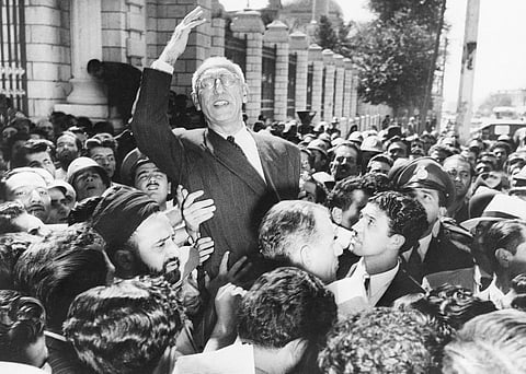 FILE - Prime Minister Prime Minister Mohammad Mosaddegh rides on the shoulders of cheering crowds in Tehran's Majlis Square, outside the parliament building, on Sept 27, 1951. (Photo | AP)