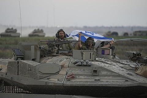 Israeli tanks head towards the Gaza Strip border in southern Israel on Oct 12, 2023. (AP)