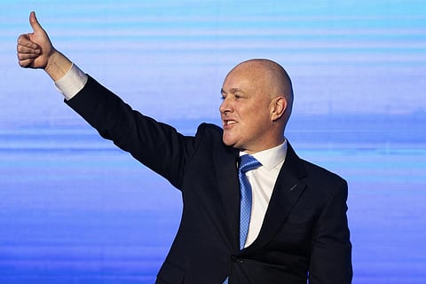 New Zealand national party leader and Prime Minister elect Christopher Luxon grestures to supporters at a party event in Auckland, Oct 14, 2023. (Photo | AP)