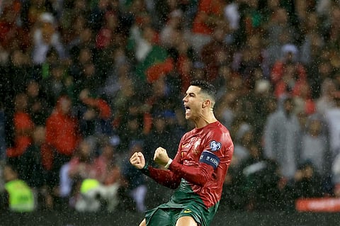 Portugal's Cristiano Ronaldo celebrates after scoring his side's third goal. (Photo | AP)