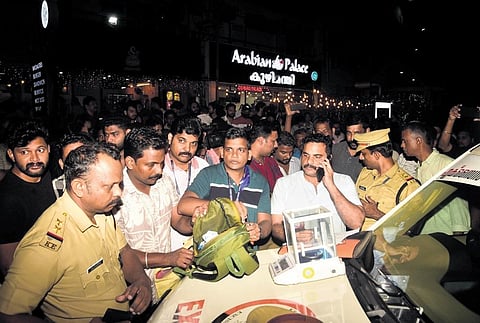 The excise squad weighing the seized MDMA at Jawaharlal Nehru International Stadium in Kaloor on Friday night | A Sanesh