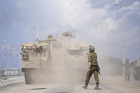 An Israeli armoured personnel carrier (APC) heads towards the Gaza Strip border in southern Israel on Sunday, Oct. 15, 2023. (Photo | AP)