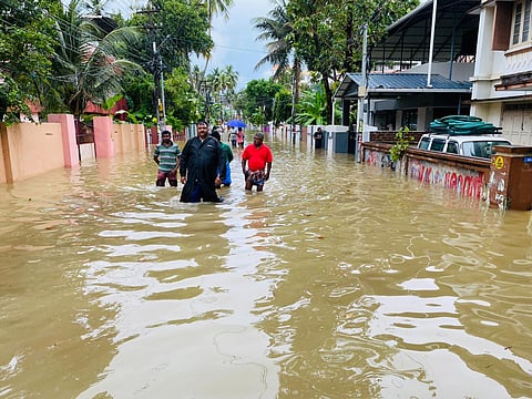 Fire and rescue personnel evacuating the public from waterlogged Puthenpalam in Thiruvananthapuram (PB Deepu)