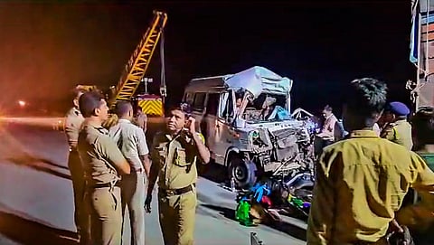 Police personnel at the spot after a speeding mini-bus hit a container on Samruddhi Expressway, in Chhatrapati Sambhajinagar district, early Sunday morning, Oct. 15, 2023. (Photo | PTI)