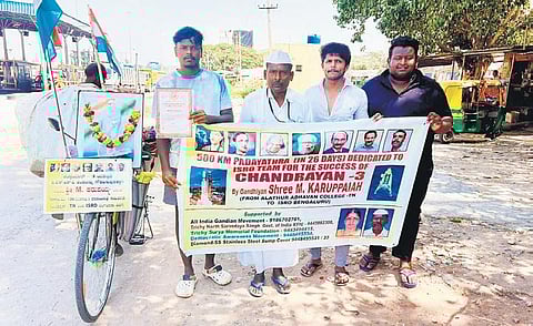 Gandhian M Karuppaiah (in white cap), spreading awareness on Mahatma Gandhi’s principles, on his way to meet and congratulate ISRO scientists. (Photo | Express)