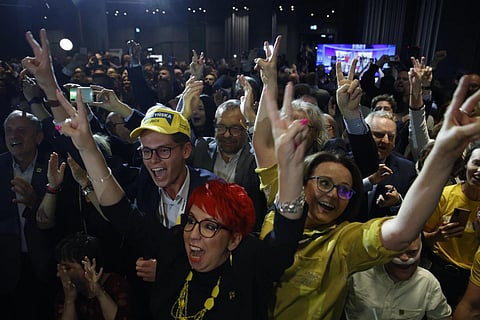 Supporters of the Third Way, a coalition of the centrist Poland 2050 party and the agrarian Polish People's Party celebrate, Oct 15, 2023. (Photo | AP)