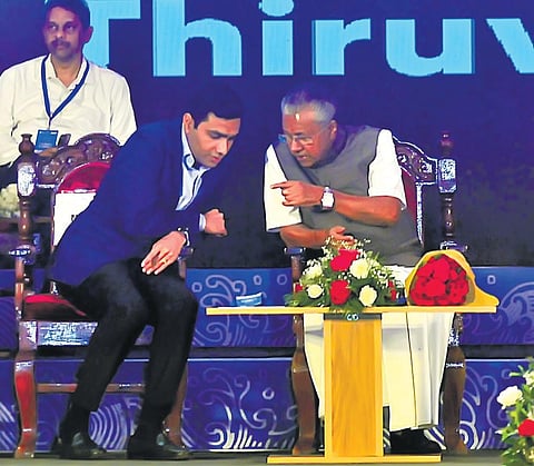 Chief Minister Pinarayi Vijayan interacts with Karan Adani, CEO of Adani Ports and Special Economic Zone, during the reception accorded for first ship that reached Vizhinjam International Seaport on S