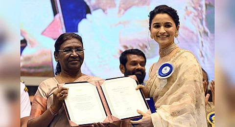 President Droupadi Murmu presents the award for Best Actress (Shared) category to Alia Bhatt for the movie Gangubai Kathiawadi during the 69th National Film Awards. | Shekhar Yadav