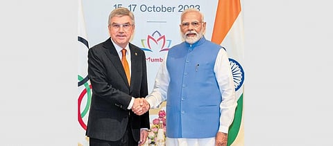 IOC president Thomas Bach greeting PM Narendra Modi on Oct 14, 2023. (Photo | PTI)
