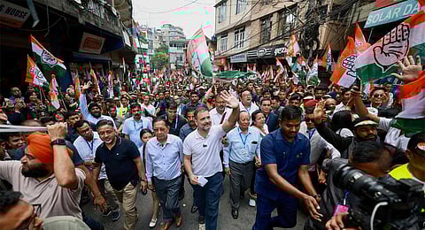 Congress leader Rahul Gandhi waves at supporters during a 'Padyatra' from Chanmari to Raj Bhawan, in Aizawl, Mizoram, Monday, Oct. 16, 2023. (Photo | PTI)