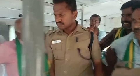 DSP Parthipan inside the bus during the arrest of farmers in Dharapuram. (Photo | Express)