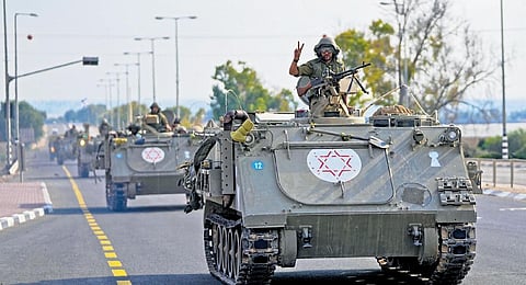 Israeli armoured vehicle convoy heads towards the Gaza border on Monday | ap/pti