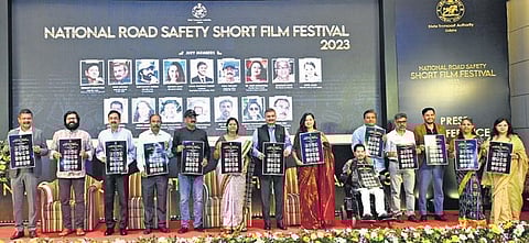 Dignitaries holding the poster of the short film festival | Express