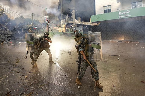 Lebanese army soldiers clash with protesters during a demonstration, in solidarity with the Palestinian people, near the US embassy in Beirut, Wednesday, Oct. 18, 2023. (Photo | AP)