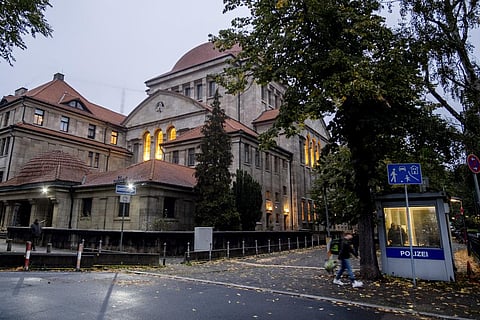 A police officer stands in a police facility, right, outside a synagogue in Frankfurt, Germany, early Thursday, Oct. 19, 2023. (Photo | AP)
