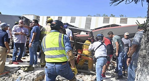 Rescue workers search for survivors amid debris after the roof of a church collapsed during a Sunday Mass in Ciudad Madero, Mexico. (Photo | AP)