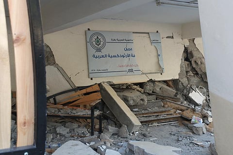 Debris and rubble litter the ground a day after the Greek Orthodox Saint Porphyrius Church, the oldest church still in use in Gaza, was damaged in a strike on Gaza City on October 20, 2023. (AFP)