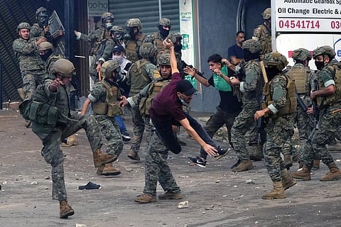 Lebanese soldiers scuffle with protesters during a demonstration, in solidarity with the Palestinian people in Gaza, near USÂ Embassy in Aukar, a northern suburb of Beirut, Lebanon, on Oct 18. (AP)