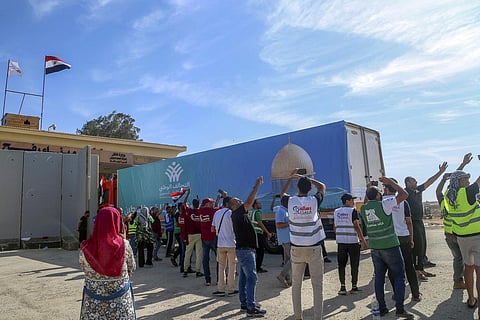 A truck of the Egyptian National Alliance carrying humanitarian aid for the Gaza Strip cross the Rafah border gate, in Rafah (Photo | AP)
